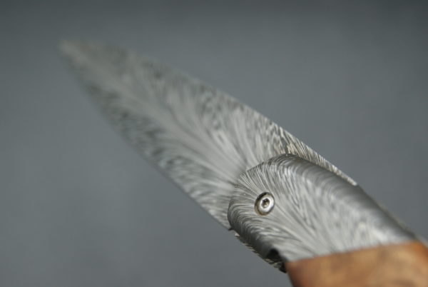 Pliant liner lock damas plume Amboine et résine
